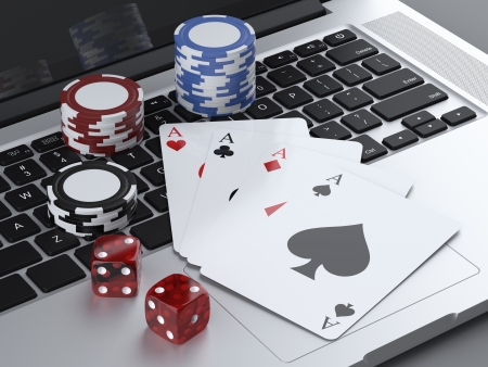 laptop with gambling chips and poker cards isolated on a white background. 3d render
