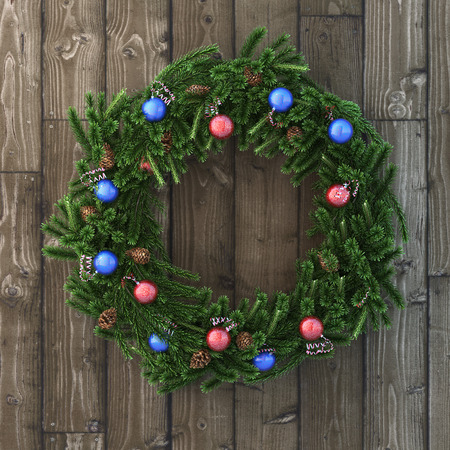 Christmas decorative wreath with balls on woodの写真素材