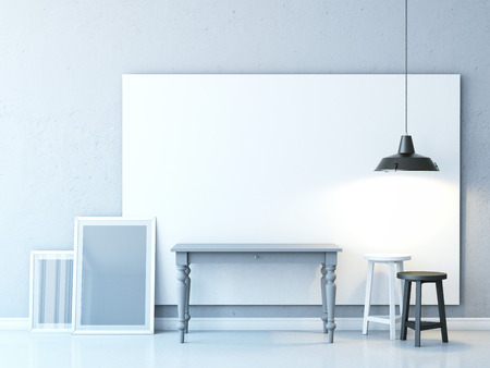 Light room with table and blank framesの写真素材