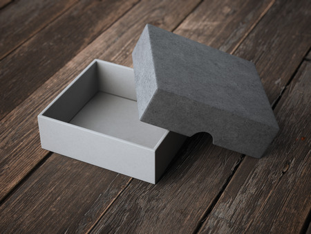 Open gray box on wooden tableの写真素材