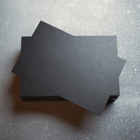 Black business cards on concreteの写真素材