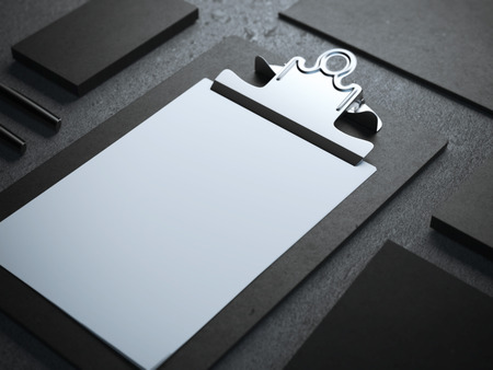 Black branding mockup with clipboard on the floorの写真素材