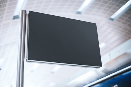 Black blank signboard on the metal post