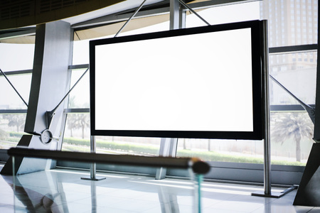 Blank billboard in modern interior with window
