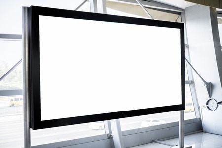 Blank billboard in modern steel interior with window