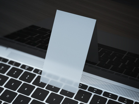 Transparent business card on a modern laptop