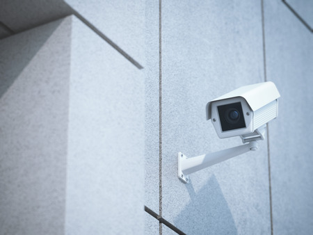 White camera on the concrete office wall. 3d rendering