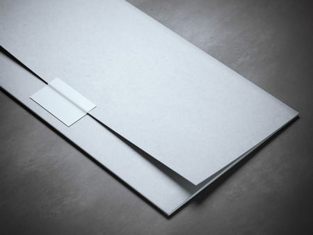 Stylish envelope with silver sticker on gray floorの写真素材