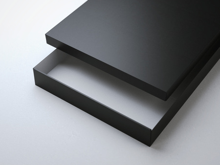 Opened black cardboard package on white floor