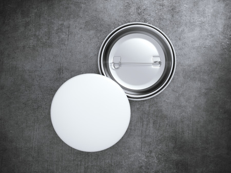 Two Blank badges on the concrete floor. 3d renderingの写真素材