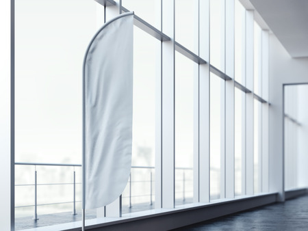 White vertical wind banner in office interior. 3d renderingの写真素材