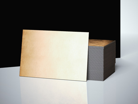 Stack of blank gold business cards in modern studio. 3d renderingの写真素材