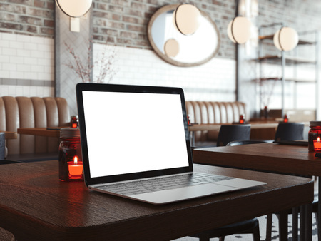 Laptop on the wooden table in modern cafe interior. 3d renderingの写真素材