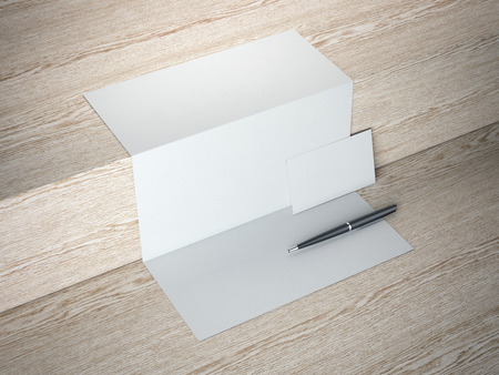Black blank paper sheet and pen on wooden floor. 3d renderingの写真素材