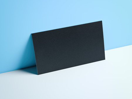 Black business card in blue modern studio. 3d renderingの写真素材