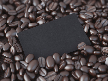 Blank black business card in brown coffee beans. 3d renderingの写真素材