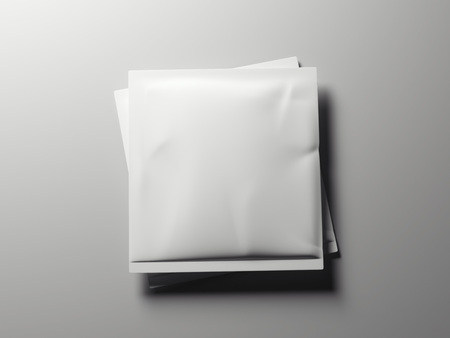 Two white packaging on the gray floor. 3d renderingの写真素材