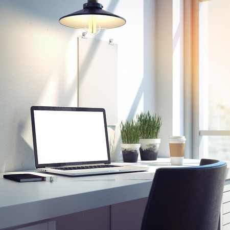 Workspace with silver modern laptop on the desk. 3d rendering