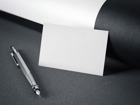 White blank business card with pen on gray floor. 3d renderingの写真素材