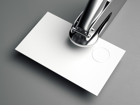 Metal embosser with blank business card on gray floor. 3d renderingの写真素材