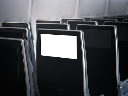 Blank aircraft monitor in dark passenger seat. 3d renderingの写真素材