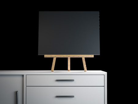 Wooden easel with black blank frame. 3d renderingの写真素材