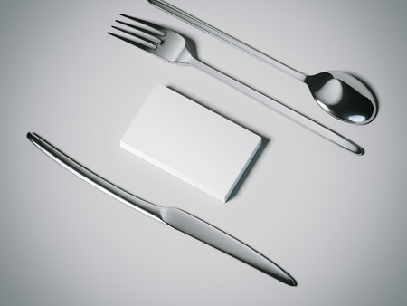 Knife, fork and spoone with business cards. 3d renderingの写真素材