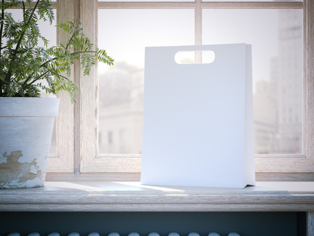 White shopping bag on a wooden window sill. 3d renderingの写真素材