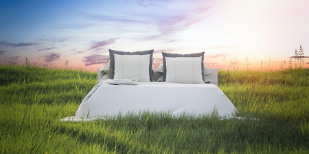 Snow-white bed in a beautiful summer field. 3d renderingの写真素材