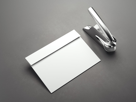 White blank envelope with metal stamp machine. 3d renderingの写真素材