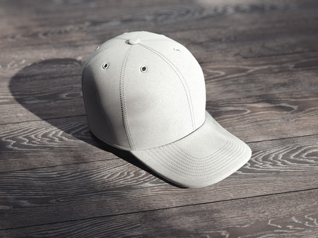 Close up of white cap isolated on wooden background, 3d renderingの写真素材