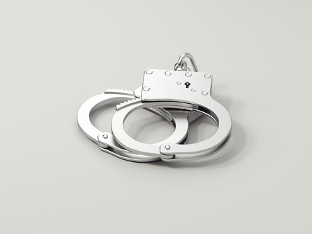 Close up of handcuffs isolated on white background, 3d rendering.の写真素材