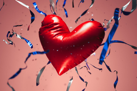 Red realistic balloon in the form of heart with serpentine. 3d rendering.の写真素材