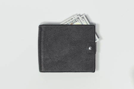 Close up of wallet with cash money isolated on white background. 3d rendering.の写真素材