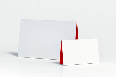 Two white blank folded leaflets on white background. 3d rendering.の写真素材