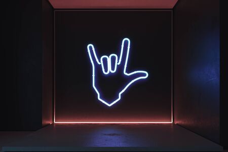 Hand in rock and roll sign made from neon lamps in dark room. 3d rendering.の写真素材