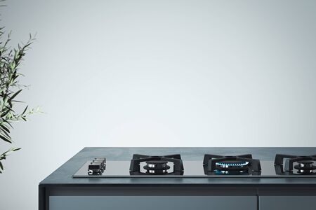 Black gas stove with burning blue flame. Interior of bright modern stylish kitchen. 3d rendering.の写真素材