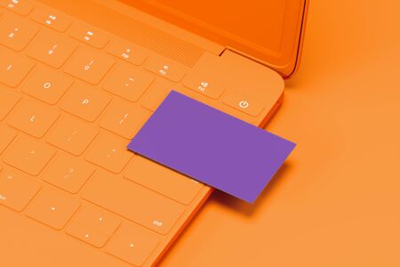 Orange laptop with violet blank business card on orange background. 3d rendering. Cozy working...