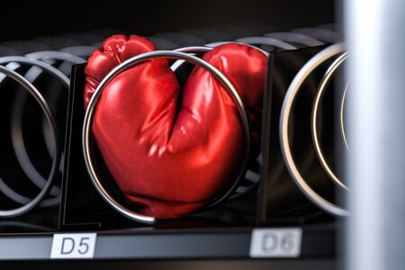 Red Realistic Pillow Heart in Vending Machine. Saint Valentine Day Celebration Concept. 3d Rendering.の写真素材