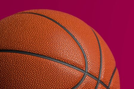 Close up Of Basketball Ball Isolated On Red Background. 3d Renderingの写真素材