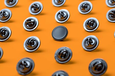 Black Blank Pin Buttons With Empty Space Isolated On Orange Background, 3d rendering.の写真素材