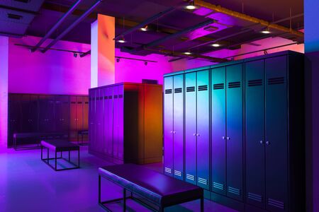 Dressing Room With Black Safe Deposit Boxes And Switched-on Neon Light. Safety Closets. Locker Room. 3d rendering.の写真素材