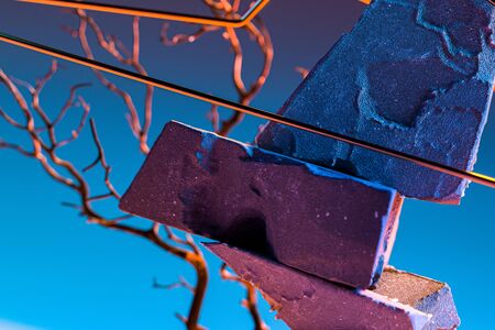 Modern Showcase As Abstract Geometric Figures Made From Stone And Branches On Blue background. 3d renderingの写真素材