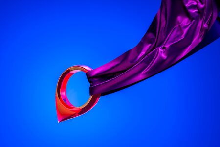 Violet Glossy Map Pin, Geo Tag With Cloth Isolated On Blue Background. 3D Rendering.の写真素材