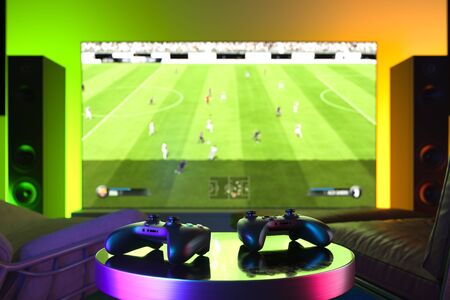 Wireless Joysticks On Foreground, Modern Tv Set With Football Soccer Video Game On Background. 3d...