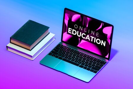 Modern Laptop With App For Online Education Near Stack Of Books. Teaching And Studying Remotely. 3d Renderingの写真素材