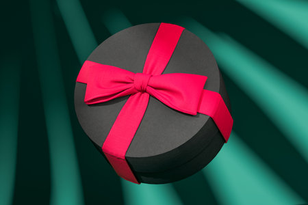 Blank round gift box with bow for holidays, celebration and sale event concept. Present package...