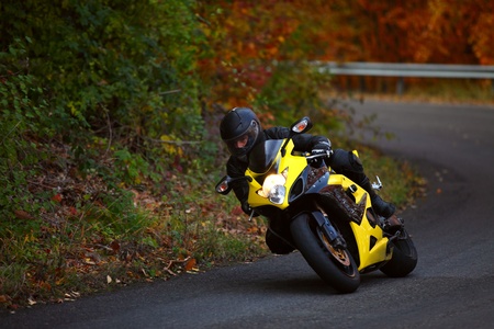 motorbike pilot coming out from curveの写真素材