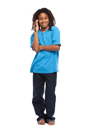 young african boy posing with cellphone in studioの写真素材