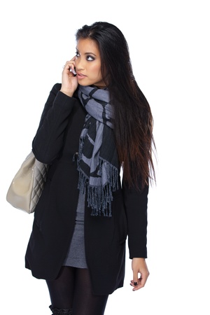 young asian woman with cellphone isolated on whiteの写真素材